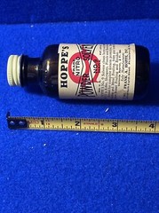 1961 HOPPE’S POWDER SOLVENT NO. 9 MARK PREVENTS RUST ON GUNS BROWN BOTTLE