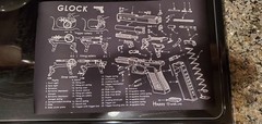 Used weapon cleaning items including a stylish rubber cleaning mat
