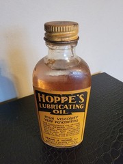 HOPPE’S Vintage glass bottle of Lubricating Oil. New never opened