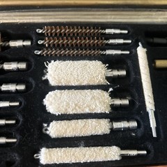 Pre-Owned DAC Gunmaster Deluxe Universal Gun Cleaning Kit with red wooden Case.