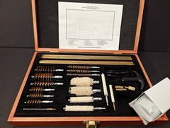 Barely Used Gunmaster Model # UGC 76W Universal Cleaning Kit in wood box