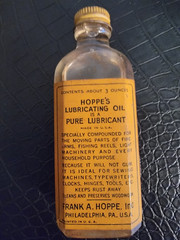 HOPPE’S Vintage glass bottle of Lubricating Oil. New never opened