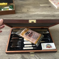 Pre-Owned DAC Gunmaster Deluxe Universal Gun Cleaning Kit with red wooden Case.