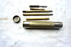 VINTAGE MARBLES NO 99 PISTOL CLEANING KIT IN METAL STORAGE TUBE