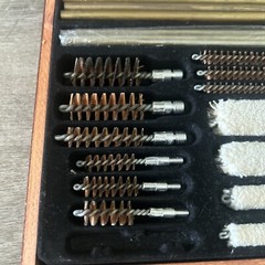 Pre-Owned DAC Gunmaster Deluxe Universal Gun Cleaning Kit with red wooden Case.