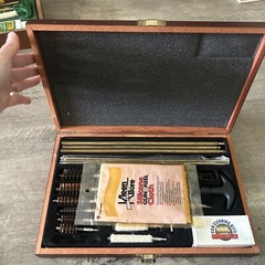 Pre-Owned DAC Gunmaster Deluxe Universal Gun Cleaning Kit with red wooden Case.