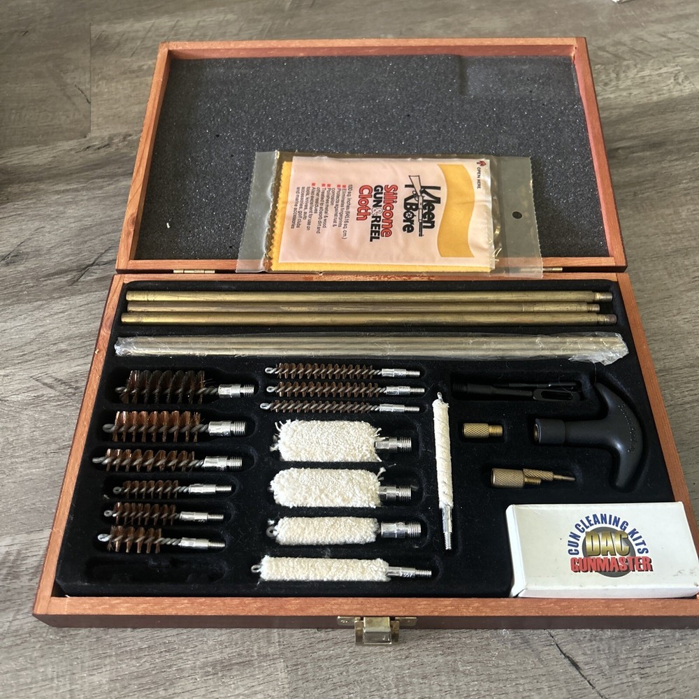 Pre-Owned DAC Gunmaster Deluxe Universal Gun Cleaning Kit with red wooden Case.