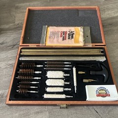 Pre-Owned DAC Gunmaster Deluxe Universal Gun Cleaning Kit with red wooden Case.