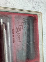 A 12-gauge shotgun cleaning kit in its original case. Italy