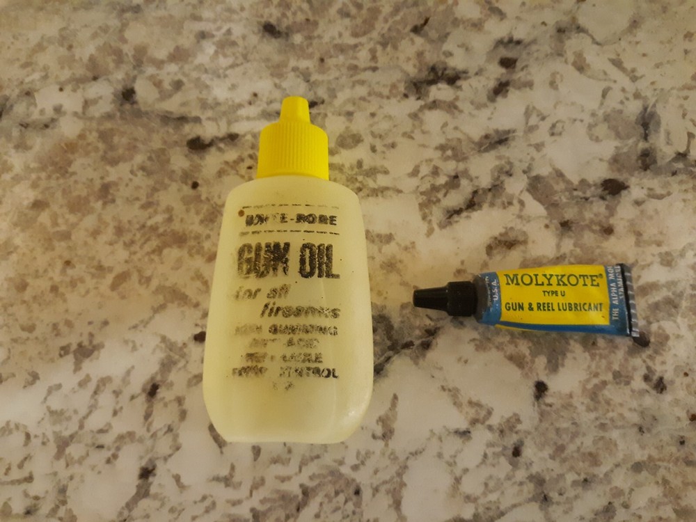 Vintage Full Brite Bore Gun Oil Bottle and Used Tube of Molykote Gun & Reel Lube